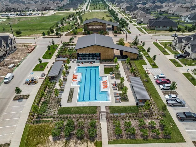 a view of a swimming pool with a patio