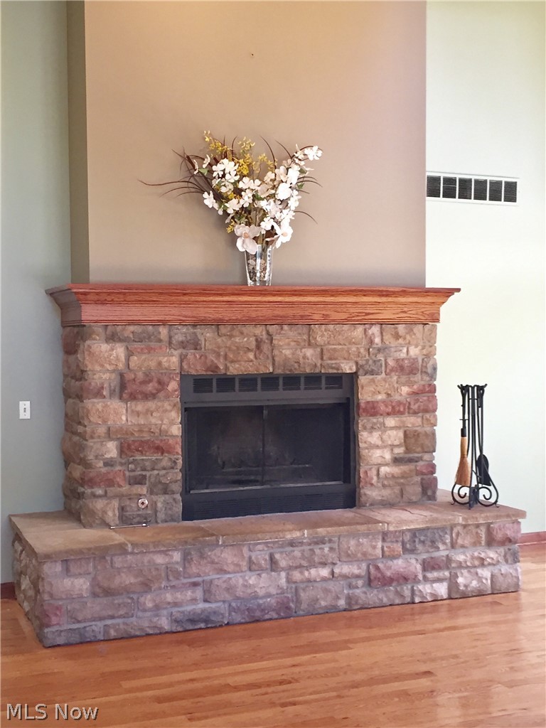 18925 Thorpe Road Chagrin Falls, OH 44023 - Photo 13 of 34 Gas fireplace with stone surround, wood mantle and neutral wall colors - just beautiful.