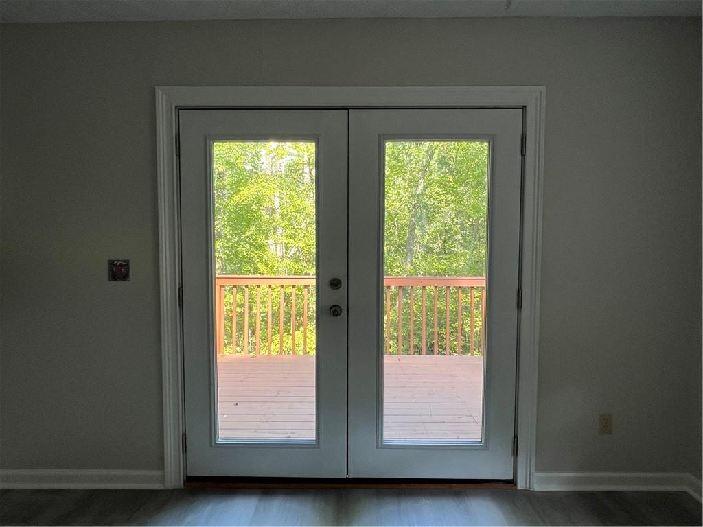 129 Pine Road Dahlonega, GA 30533 - Photo 13 of 27 a view of room with window and doors
