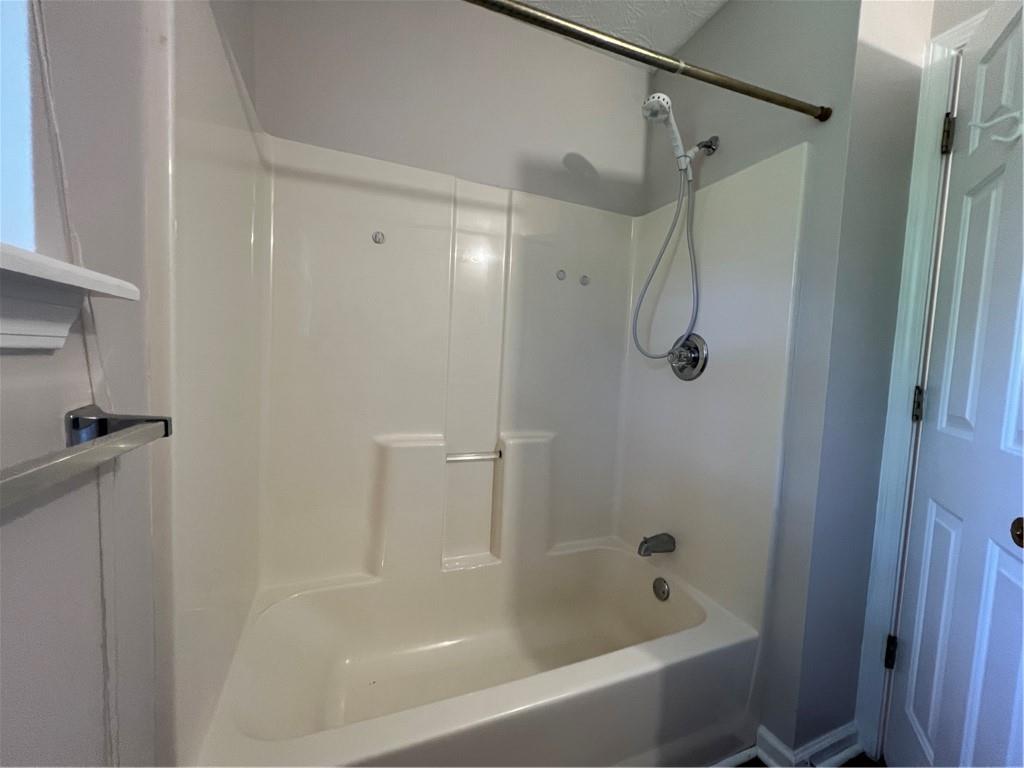 129 Pine Road Dahlonega, GA 30533 - Photo 25 of 27 a bathroom with a bath tub with a shower