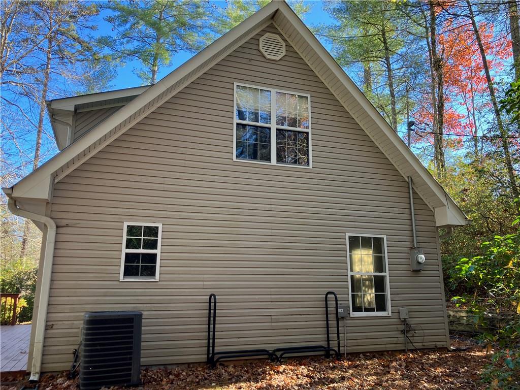 129 Pine Road Dahlonega, GA 30533 - Photo 5 of 27 a view of a house with a yard and garage