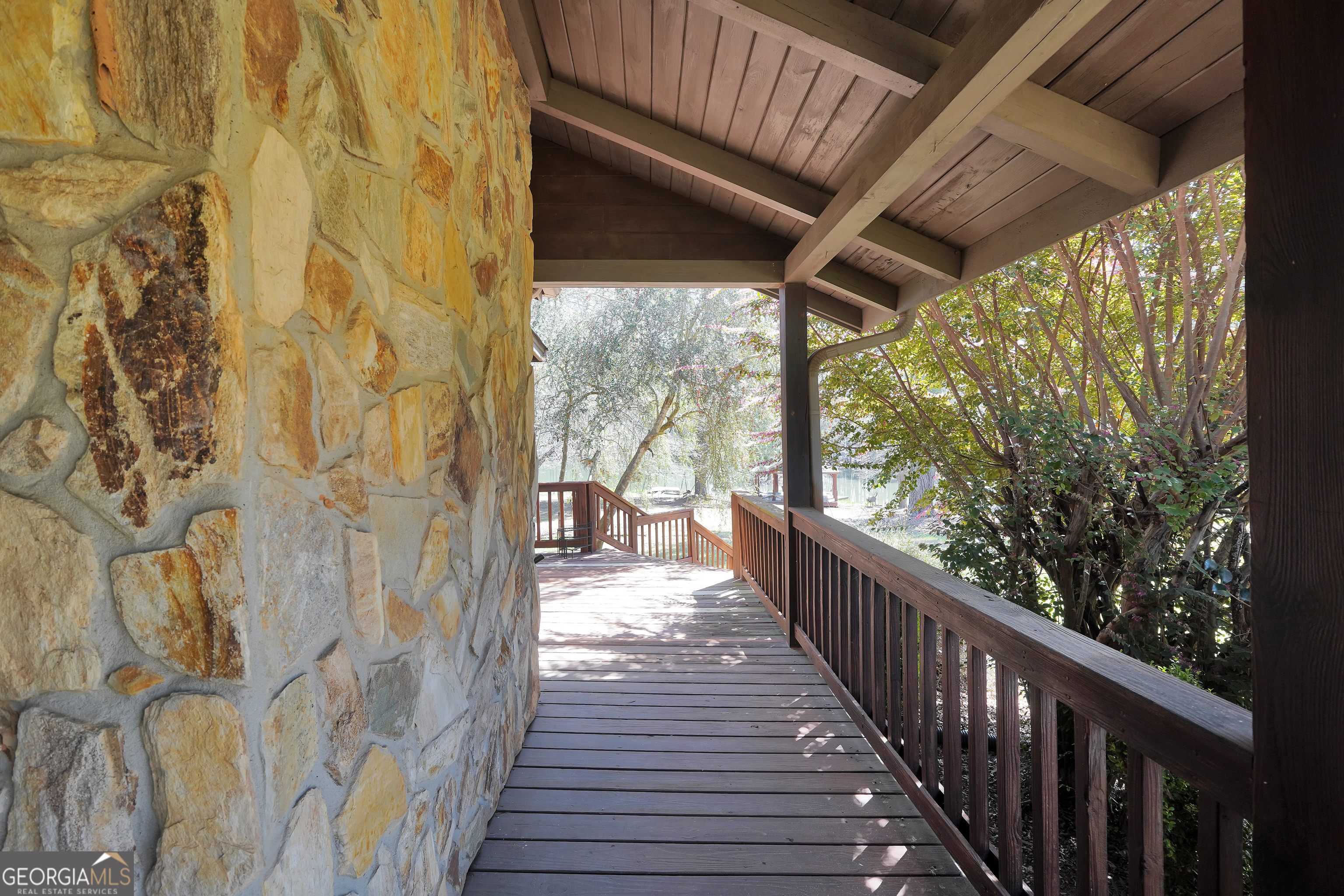 330 Country Kitchen Road Barnesville, GA 30204 - Photo 10 of 64 a view of a porch with wooden floor and outdoor space