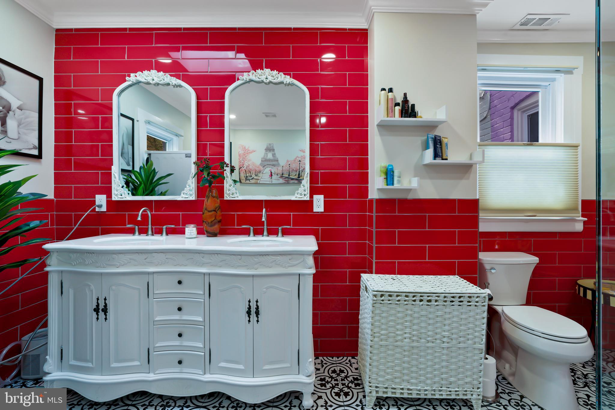 1215 33rd Street Northwest Washington, DC 20007 - Photo 19 of 37 a bathroom with a toilet sink and mirror