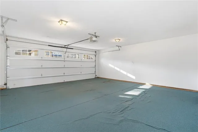 a view of a kitchen space with cabinets