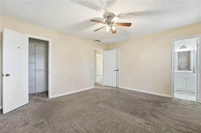 a view of an empty room with a bathroom
