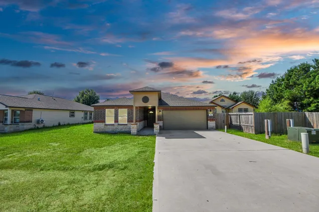 front view of a house with a big yard