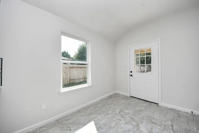 a large kitchen with kitchen island a sink dishwasher a stove and a refrigerator with wooden floor