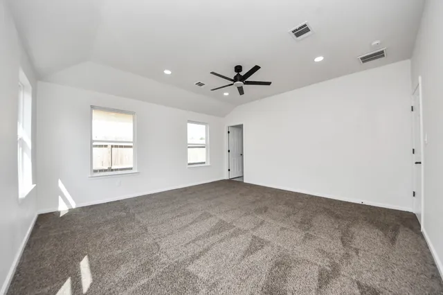 a large bathroom with a tub sink shower and mirror
