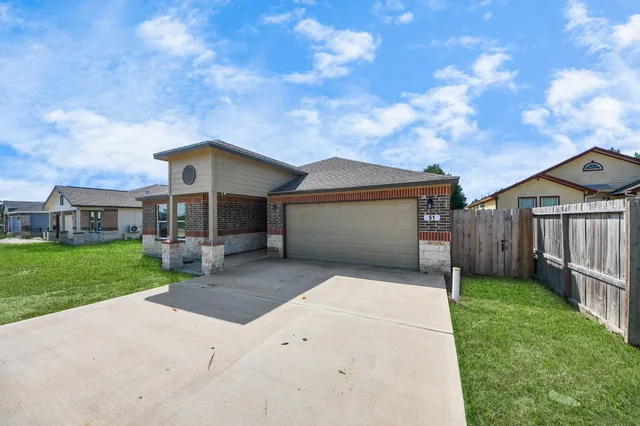 a view of green field with sitting in the background