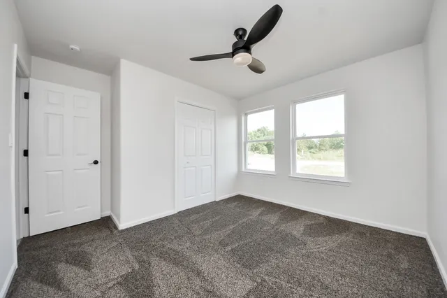 a bathroom with a sink a toilet a mirror and vanity