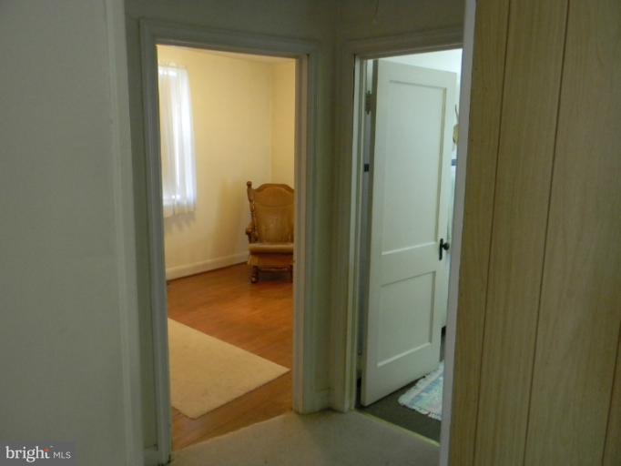 226 Pinewood Road Dundalk, MD 21222 - Photo 2 of 12 a view of a bathroom from a hallway