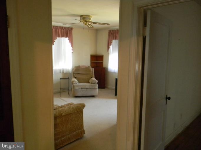 226 Pinewood Road Dundalk, MD 21222 - Photo 5 of 12 a living room with furniture and a fireplace