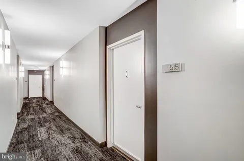 a view of a hallway view with staircase