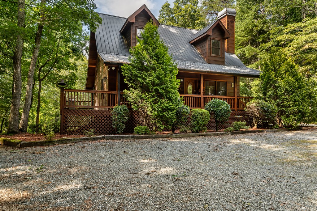 238 Hay Lane Morganton, GA 30560 - Photo 3 of 4 a front view of a house with a yard and garage