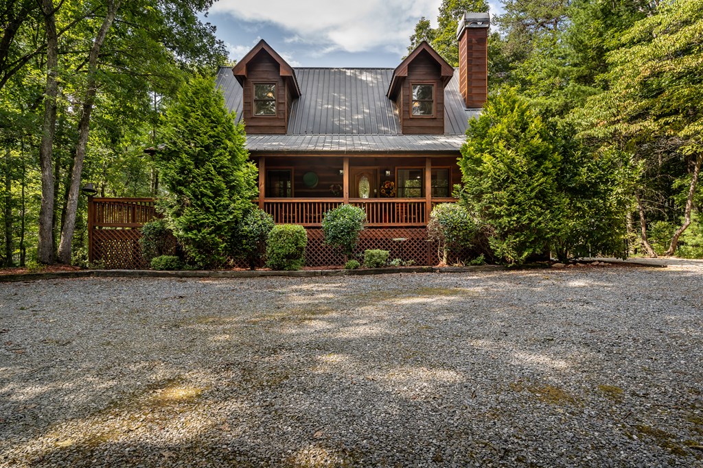 238 Hay Lane Morganton, GA 30560 - Photo 4 of 4 a front view of a house with a garden