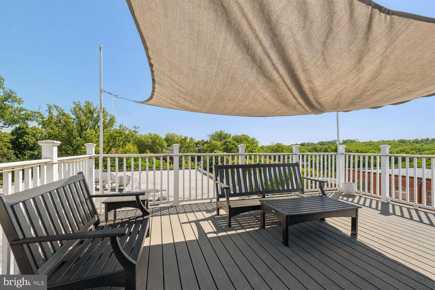 3900 Tunlaw Road Northwest, Unit 406 Washington, DC 20007 - Photo 21 of 23 a view of a two chairs on the roof deck