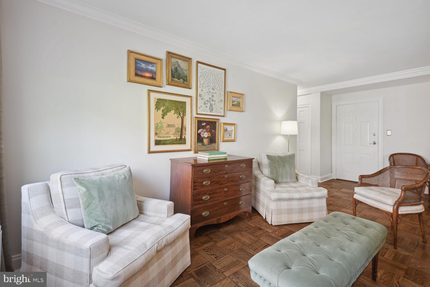 3900 Tunlaw Road Northwest, Unit 406 Washington, DC 20007 - Photo 8 of 23 a living room with furniture and painting on the wall