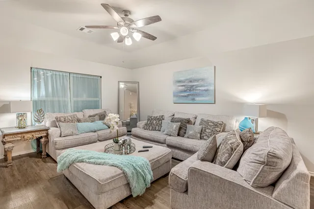a living room with furniture and a large window