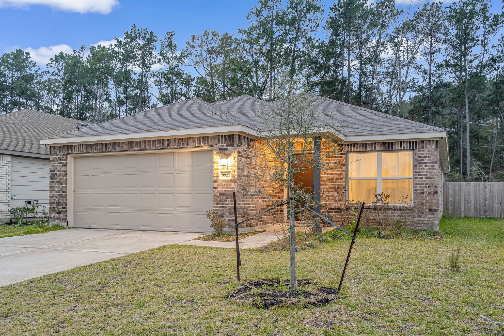 9921 Spring Creek Road Cleveland, TX 77327 - Photo 2 of 30 a house view with a backyard space