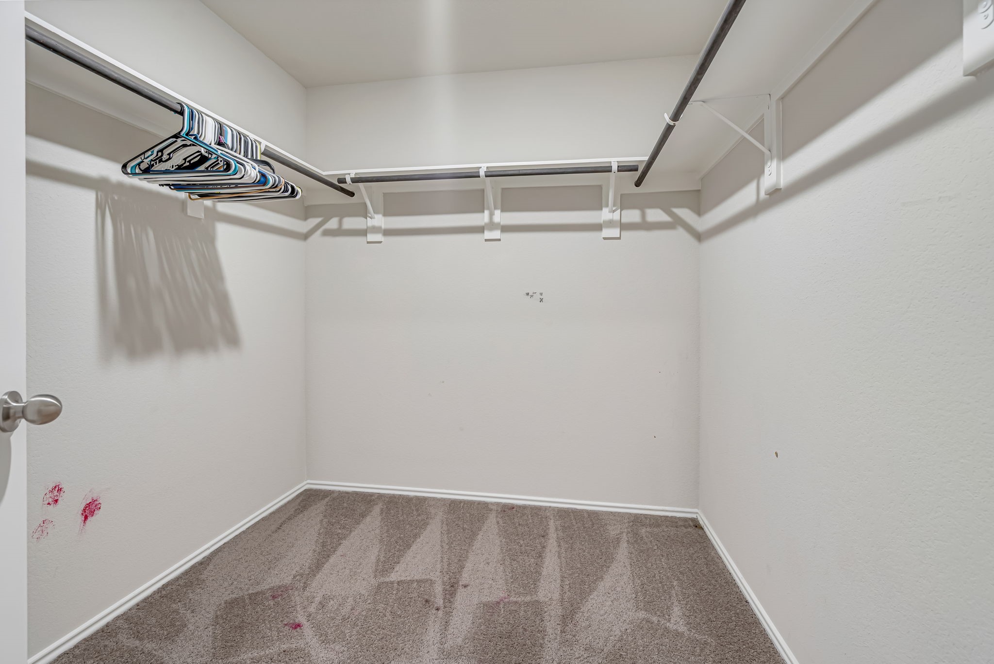 9921 Spring Creek Road Cleveland, TX 77327 - Photo 21 of 30 a view of walk in closet with clothes and shoes