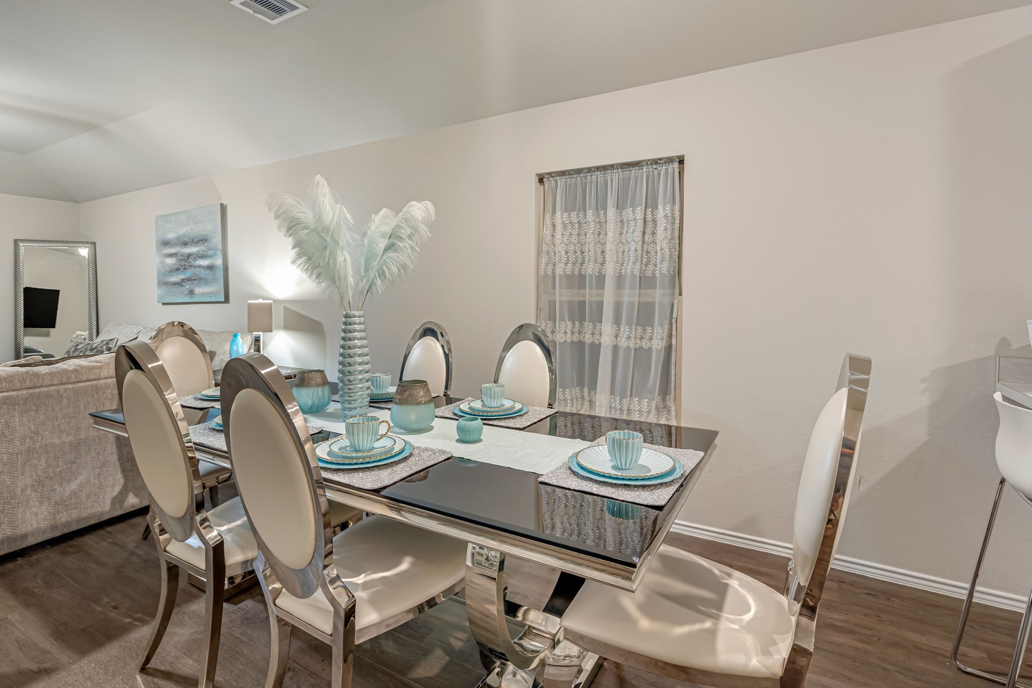 9921 Spring Creek Road Cleveland, TX 77327 - Photo 22 of 30 a dining room with furniture and wooden floor