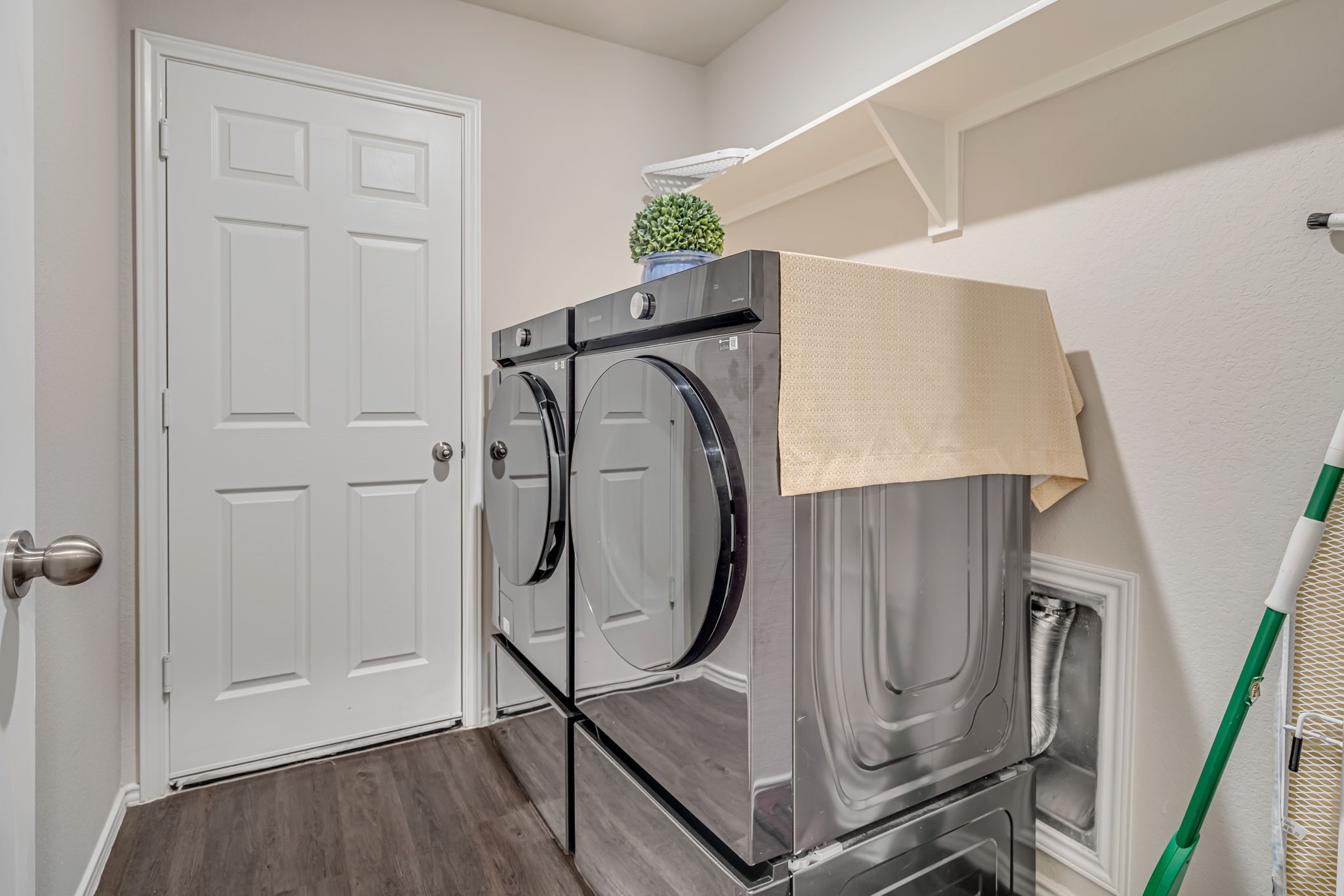 9921 Spring Creek Road Cleveland, TX 77327 - Photo 7 of 30 a view of a storage & utility room with washer and dryer