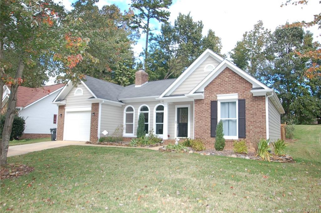 12515 Newstead Road Huntersville, NC 28078 - Photo 1 of 14 a front view of a house with a garden and trees