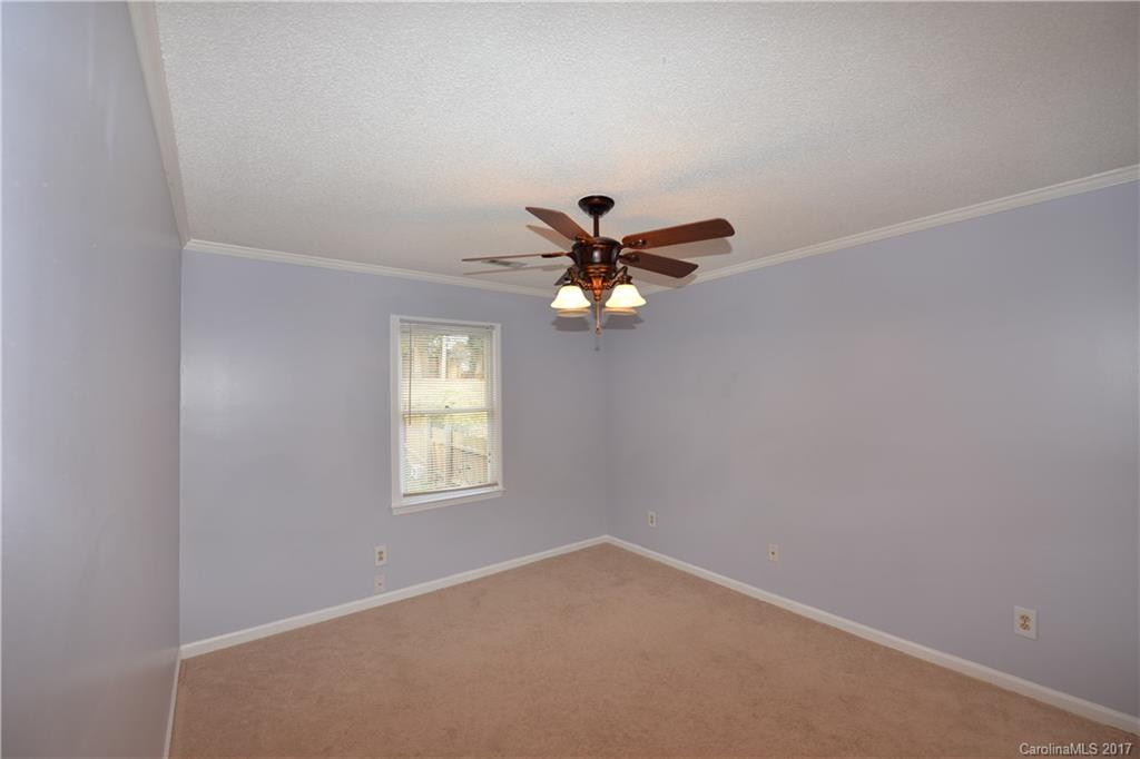 12515 Newstead Road Huntersville, NC 28078 - Photo 11 of 14 an empty room with windows and fan