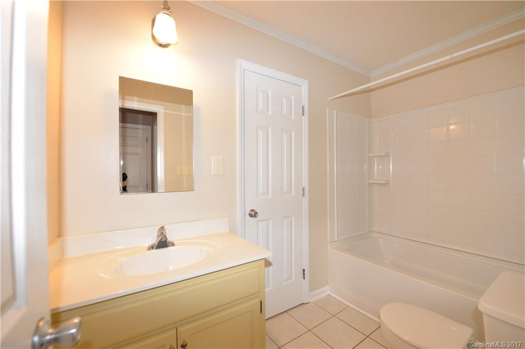 12515 Newstead Road Huntersville, NC 28078 - Photo 12 of 14 a bathroom with a sink a toilet and shower