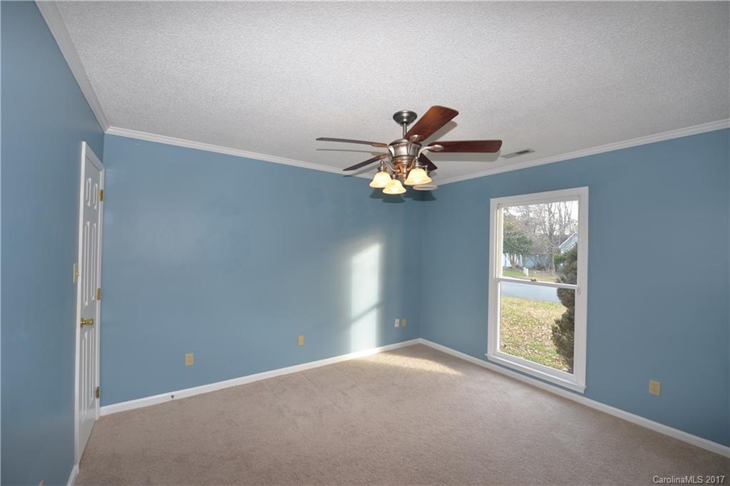 12515 Newstead Road Huntersville, NC 28078 - Photo 13 of 14 a view of a livingroom with a ceiling fan and window
