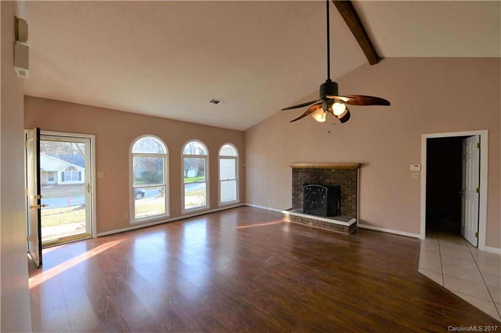 12515 Newstead Road Huntersville, NC 28078 - Photo 5 of 14 a view of an empty room with glass door and wooden floor