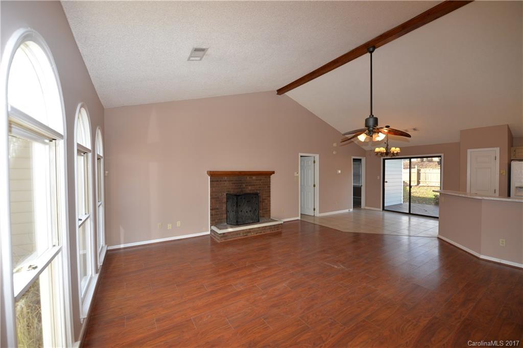 12515 Newstead Road Huntersville, NC 28078 - Photo 6 of 14 wooden floor in an empty room with a window