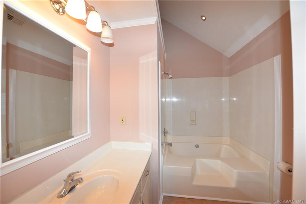 12515 Newstead Road Huntersville, NC 28078 - Photo 10 of 14 a bathroom with a tub shower and sink