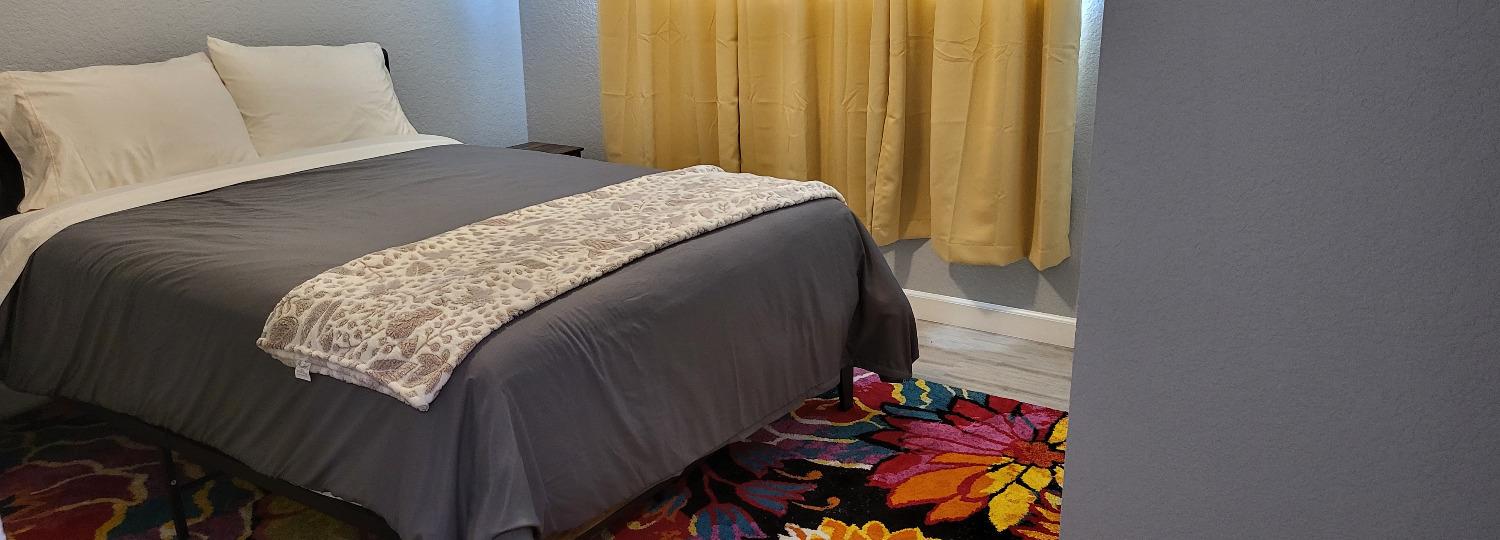 30530 George Smith Road Squaw Valley, CA 93675 - Photo 19 of 23 a bed sitting in a bedroom next to a window