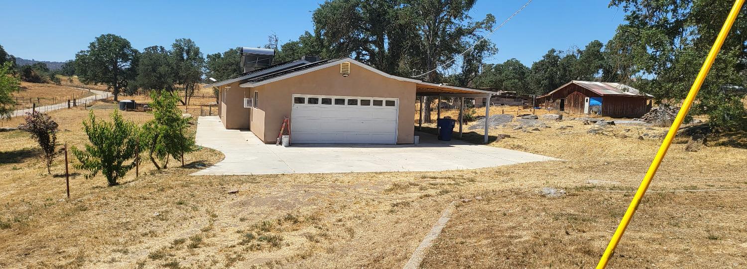 30530 George Smith Road Squaw Valley, CA 93675 - Photo 2 of 23 a view of a large house with a yard covered with snow in the background