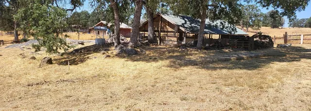 a view of yard covered with snow in front of house