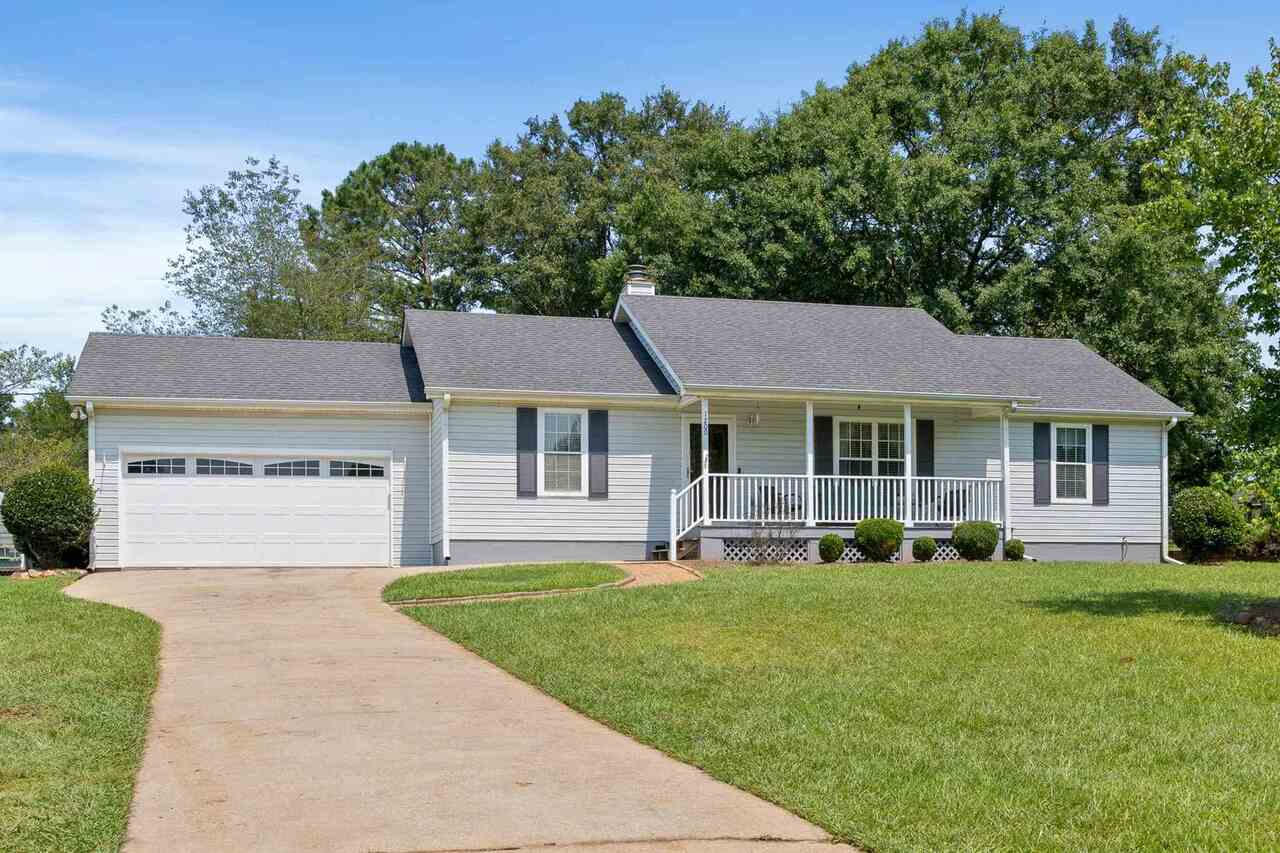 1200 South Ola Road Locust Grove, GA 30248 - Photo 1 of 1 a front view of a house with a yard and trees