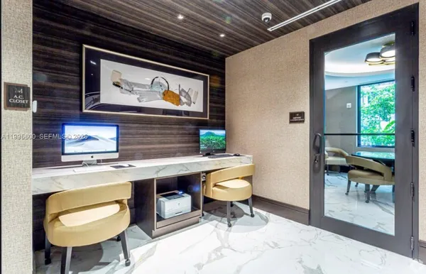 a workspace with furniture and window