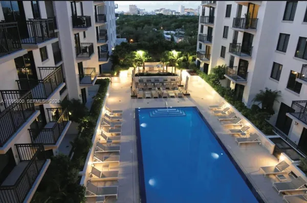 a view of swimming pool with outdoor seating