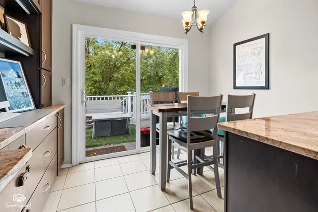 a view of a dining room with furniture window and outside view