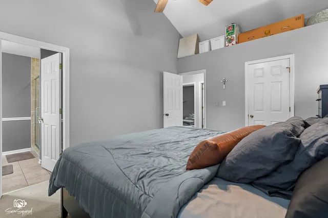 a bedroom with a bed and closet