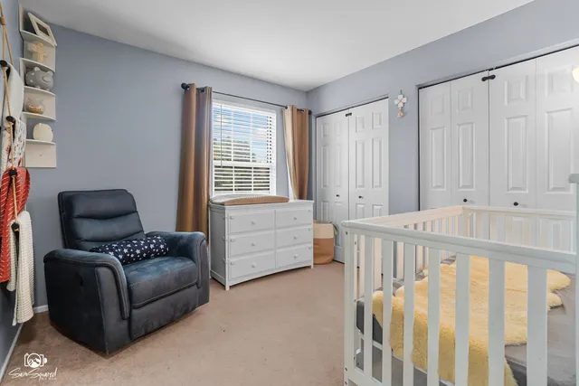 a bedroom with furniture and a window