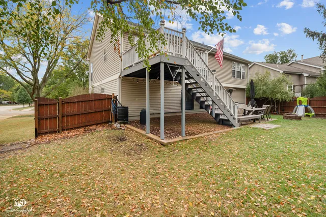 a view of a house with wooden fence