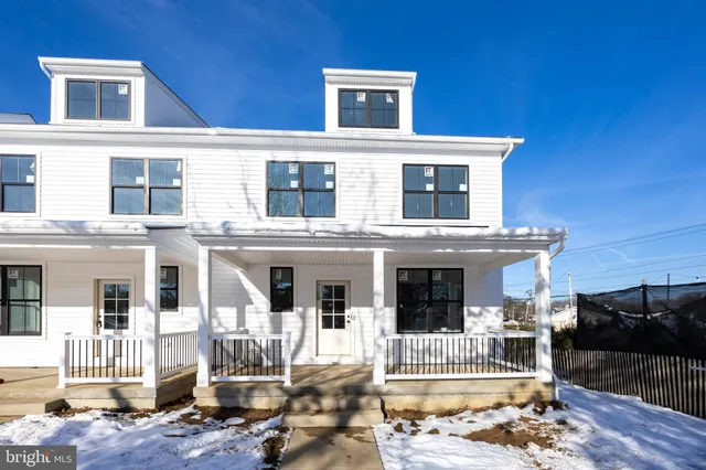a front view of a house with a porch