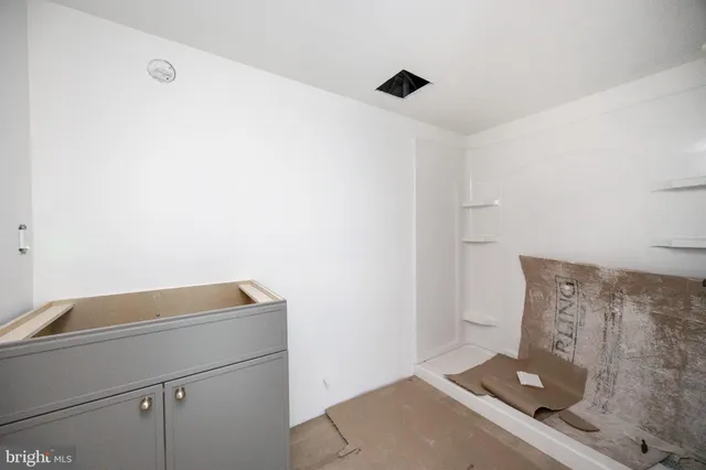 a view of an empty room with a window