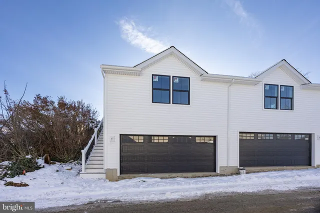 a view of kitchen with center island and stainless steel appliances