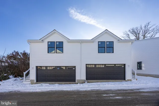 a bathroom with a tub sink vanity and mirror