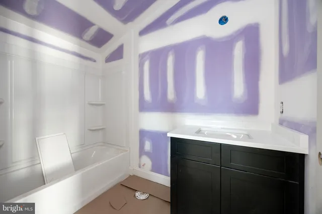 a aerial view of a house with a yard and garage