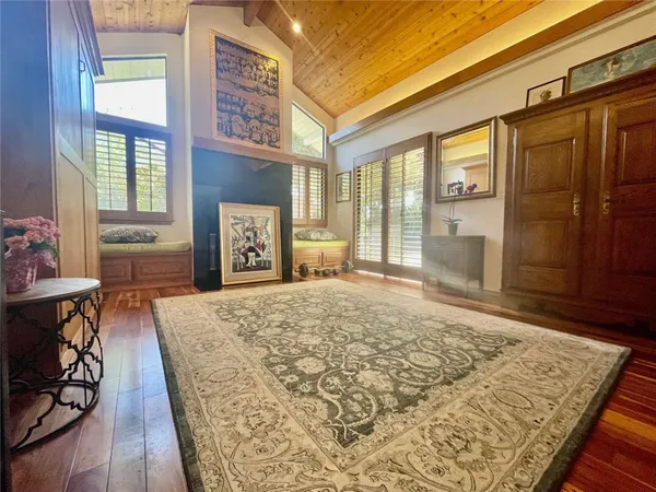 a bedroom with a bed and wooden cabinets