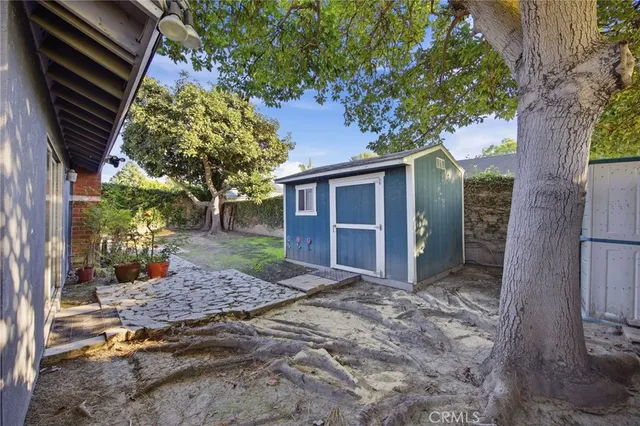 a view of a house with a tree